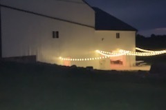 Lights with open door into barn