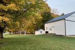 Arbor and front of barn with fall colors