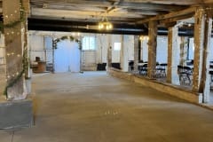 Interior of barn setup for wedding ceremony